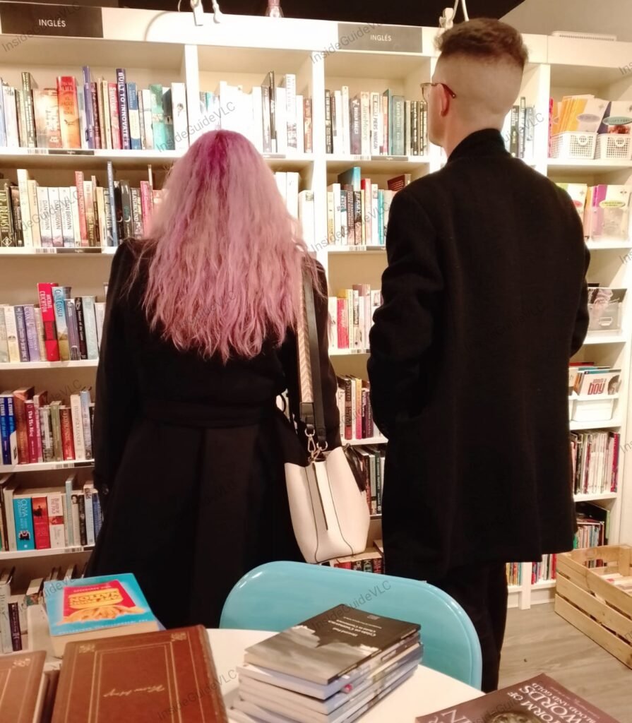 man and a woman browsing the shelves at reread.