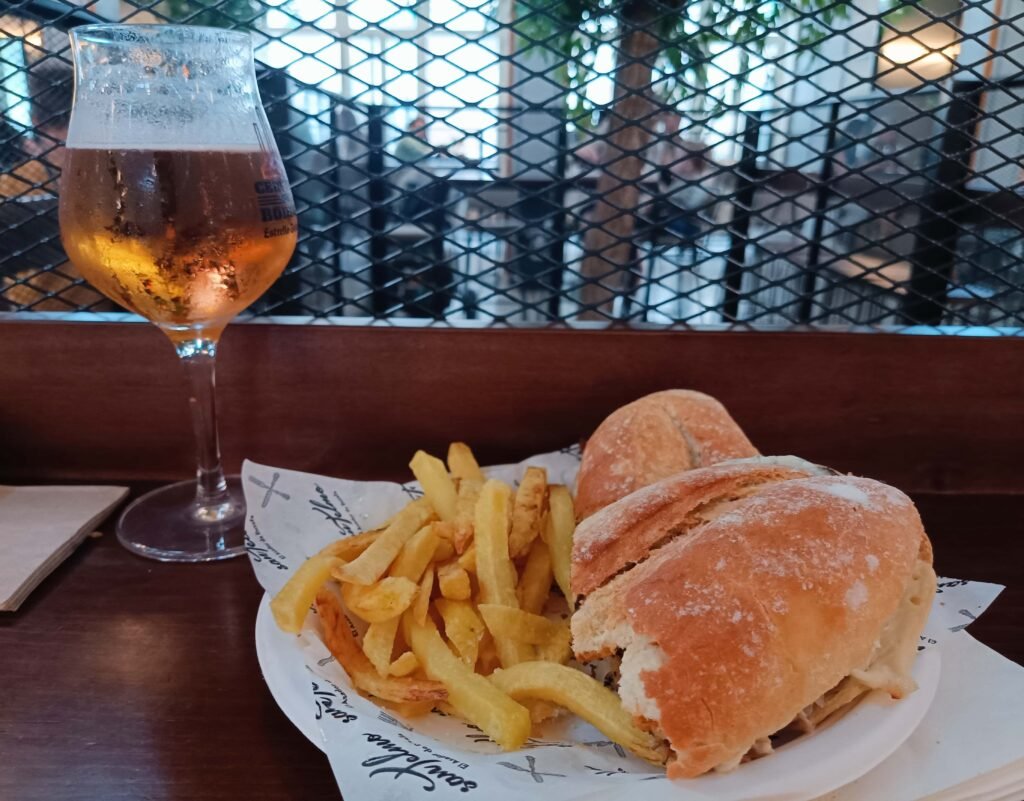 steak sandwich and beer from mercado