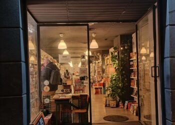 The outside of re-read at night. Lights inviting us in.