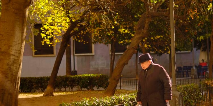 old man walking in the park in Valencia in Spain